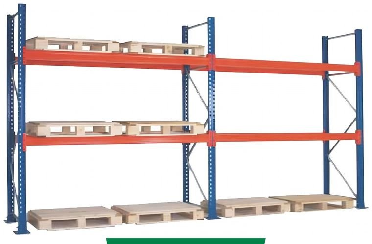 An industrial warehouse with multiple rows of blue and red metal storage racks. The floor is concrete, and the warehouse is well-lit with high ceiling lights. A fire extinguisher is located at the lower-left corner of the warehouse.